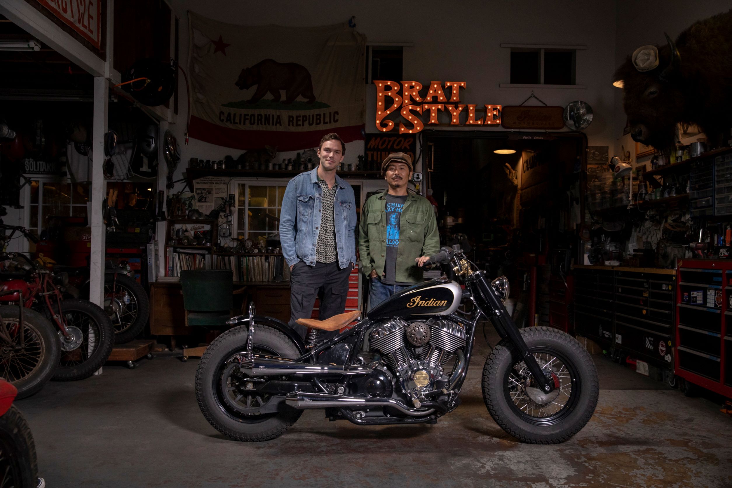 Nicholas Hoult (left) with Go Takamine and his custom 2022 Indian Super Chief Limited in Takamine's garage