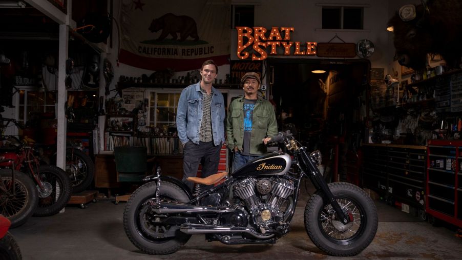 Nicholas Hoult (left) with Go Takamine and his custom 2022 Indian Super Chief Limited in Takamine's garage