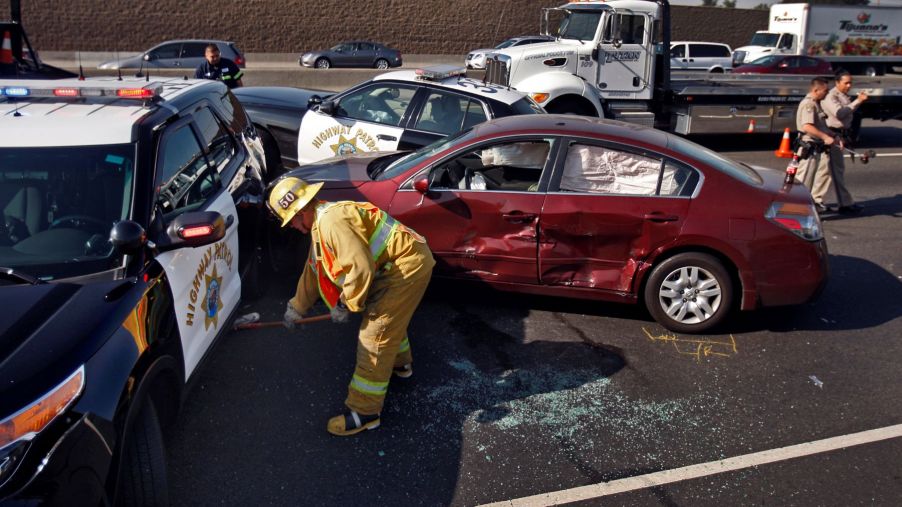 A PIT Maneuver accident aftermath with Los Angeles County firefighter and paramedic teams and California Highway Aptrol officers on-site
