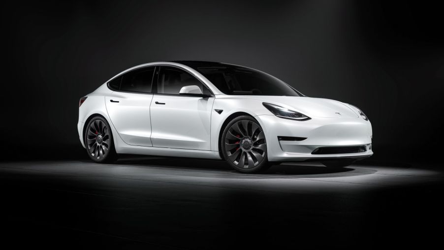 Passenger's side front angle view of white 2021 Tesla Model 3