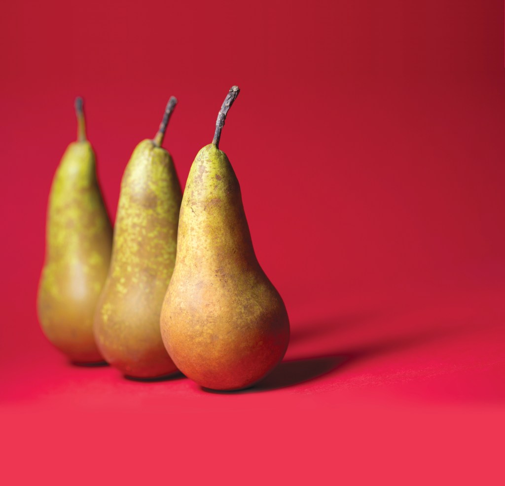 Three pears on a red background, the closest thing we have to a Fisker PEAR electric vehicle, the vehicle with the worst name ever.