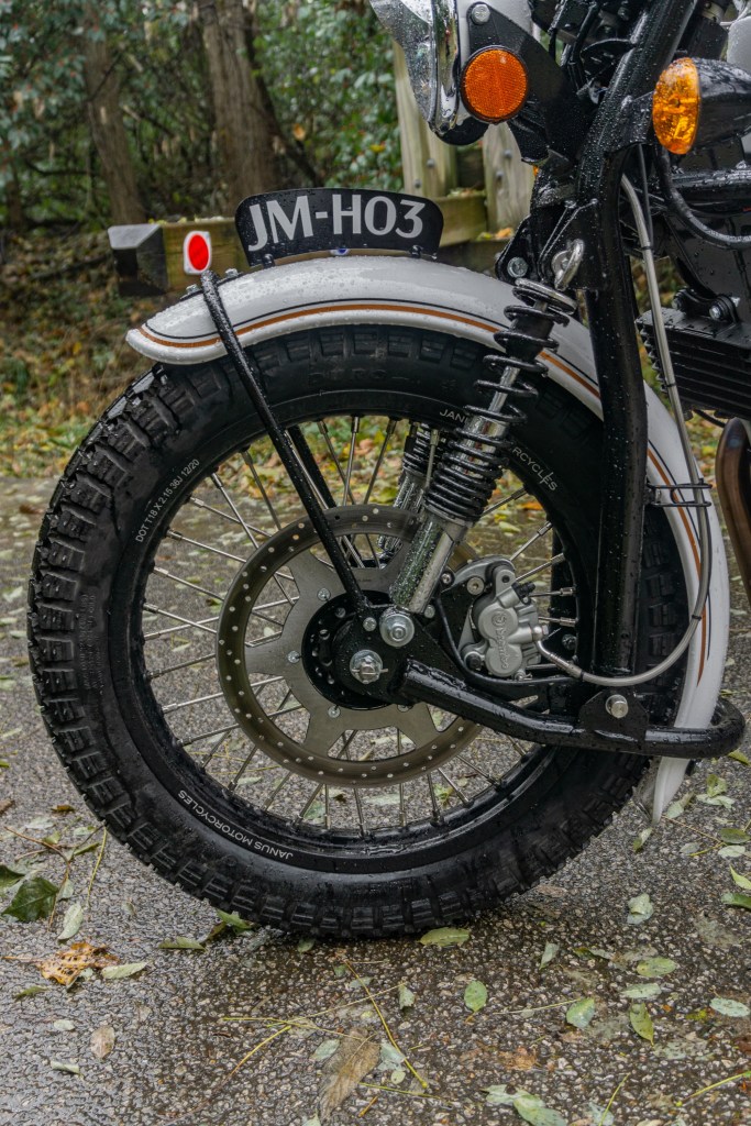 A pre-production 2021 Janus Halcyon 450's front fork and Brembo brake side view