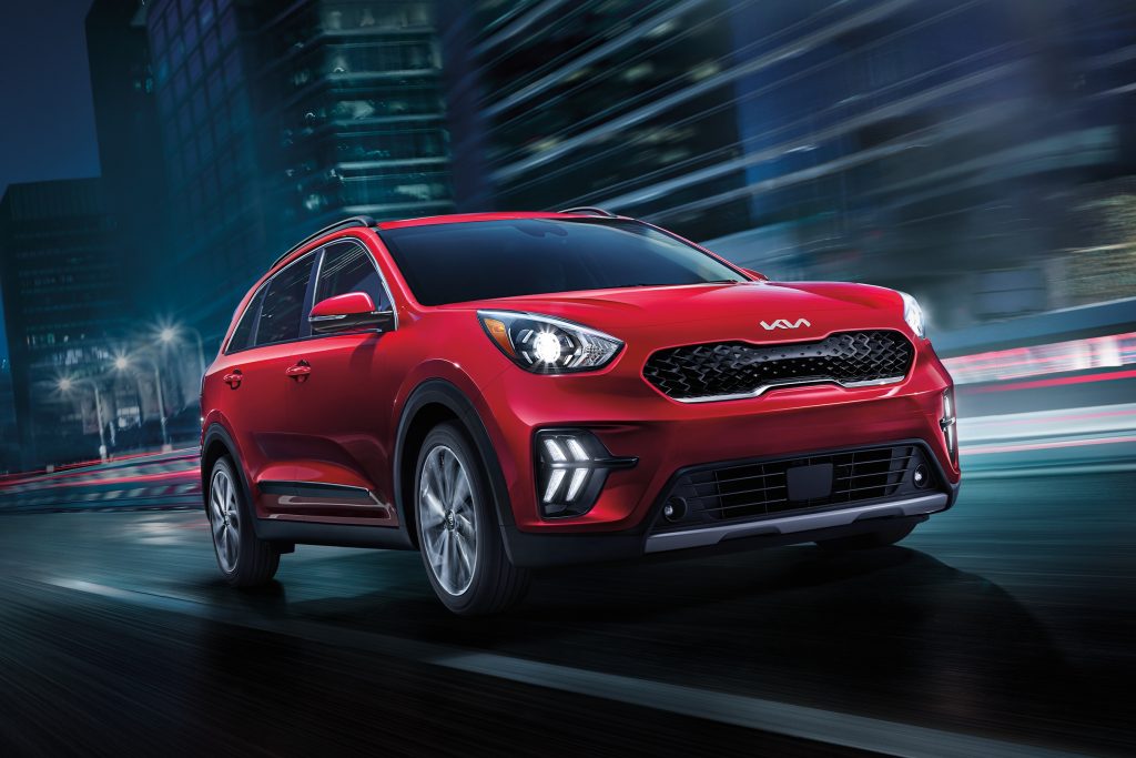 Red 2022 Kia Niro Plug-In Hybrid, one of the cheapest electric SUVs and crossovers of 2021.