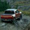 Red Canyon 2022 Rivian R1T driving off-road on a rocky hill