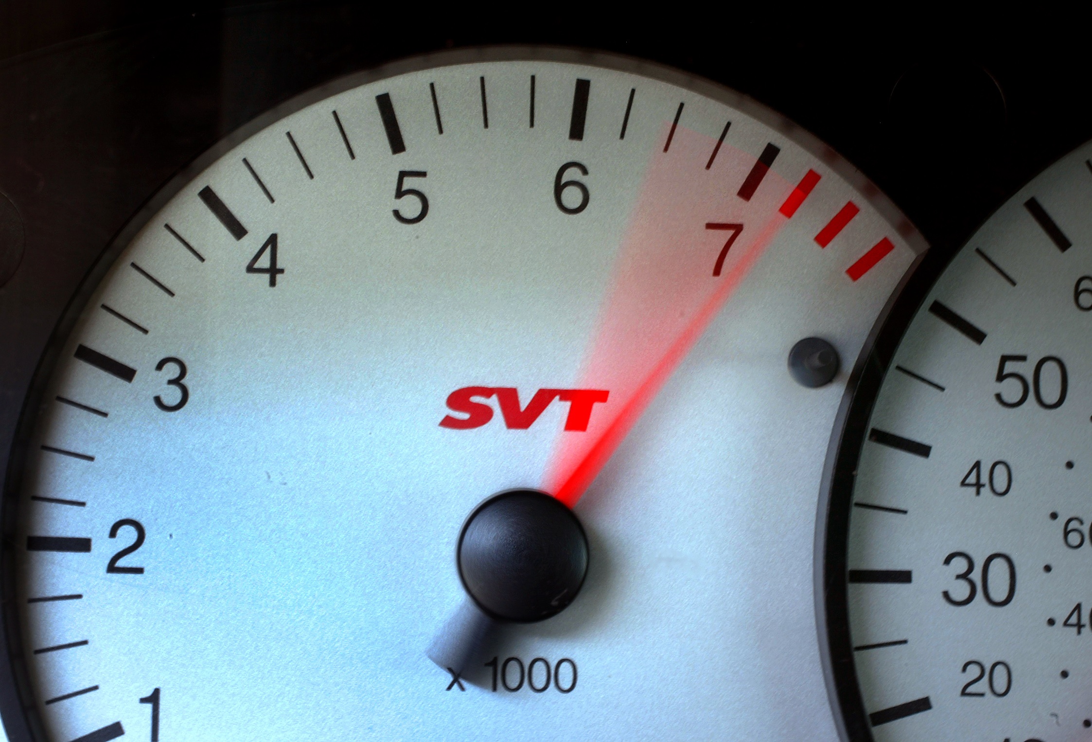 The tachometer in a Ford SVT Focus hitting the redline