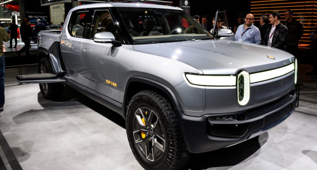 A gray Rivian R1T is on display.