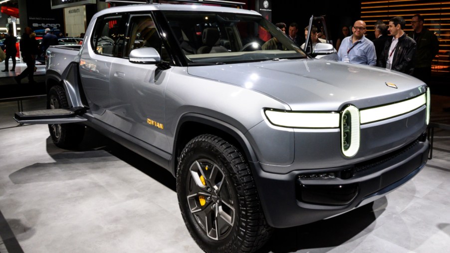 A gray Rivian R1T is on display.
