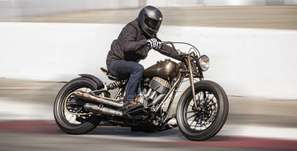 A brown-clad rider slides the Roland Sands Design 'El Camino 1946 Indian Chief chopper
