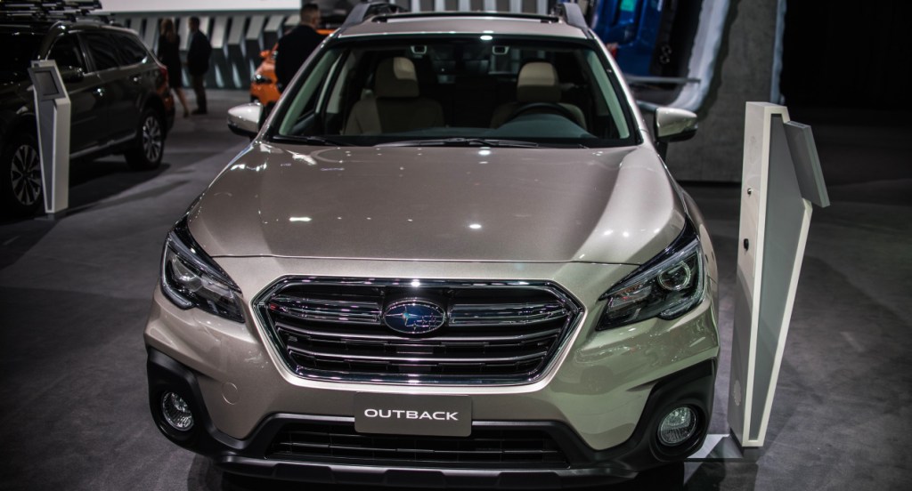A gray Subaru Outback is on display.