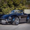 The dark-blue Superformance MKIII-E electric Shelby Cobra replica