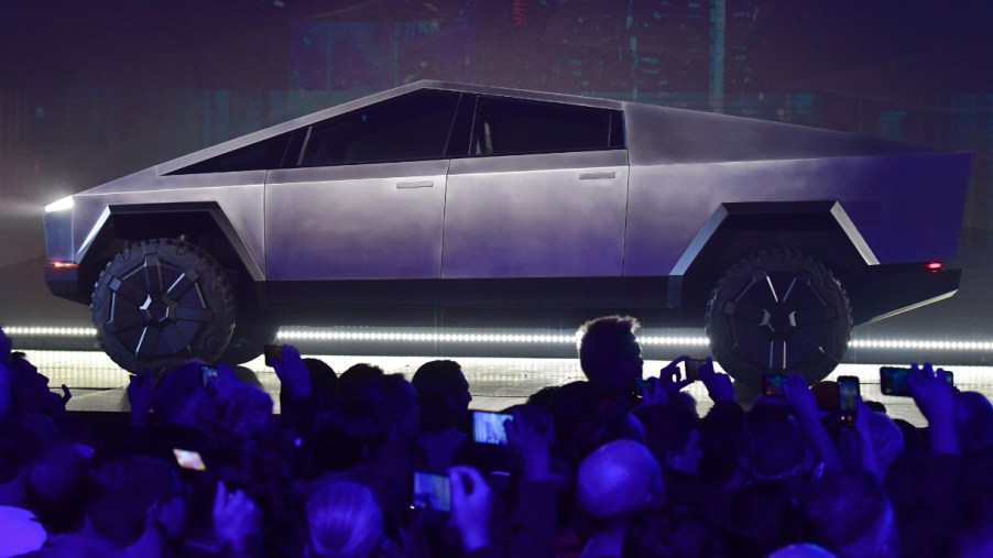 A silver Tesla Cybertruck is on display.