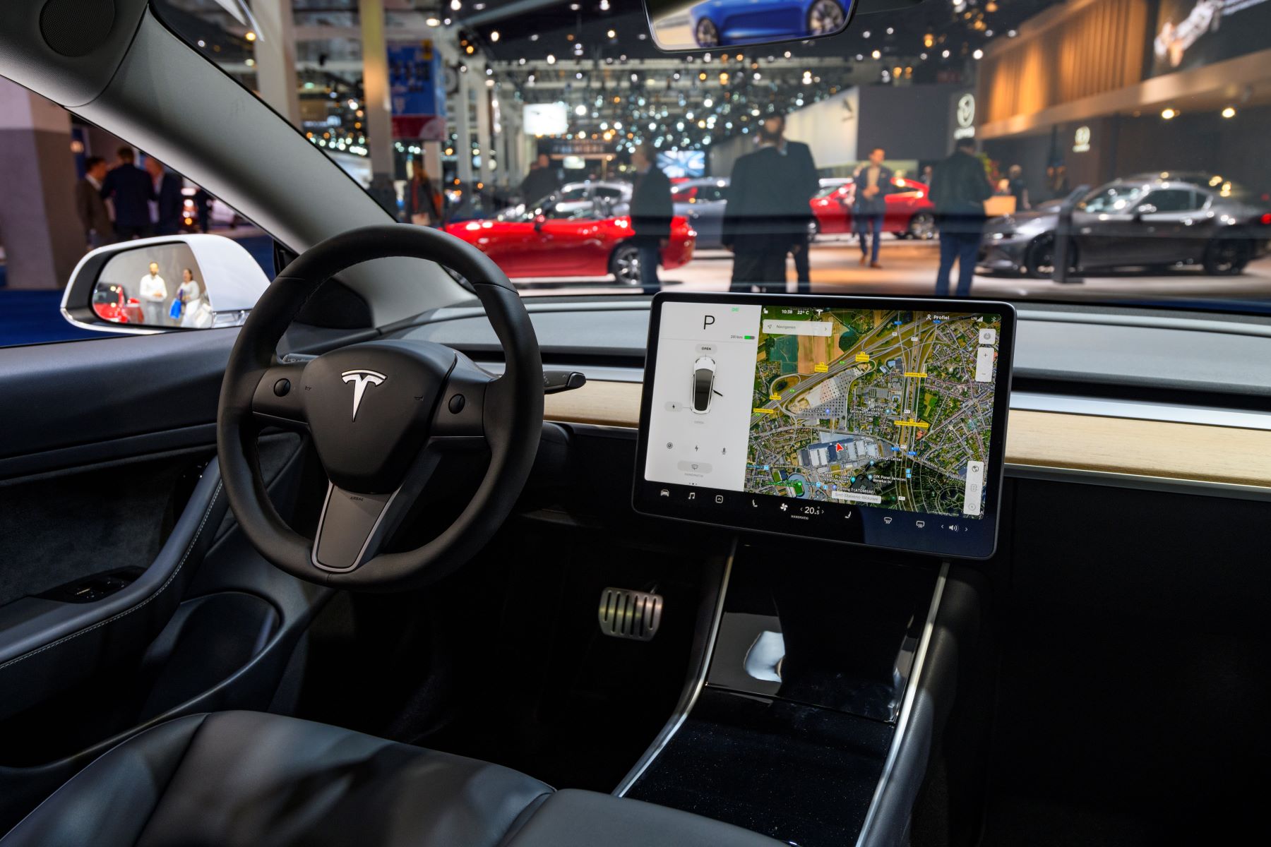 The interior of a Tesla Model 3 with its touchscreen display in use at the 2020 Brussels Expo