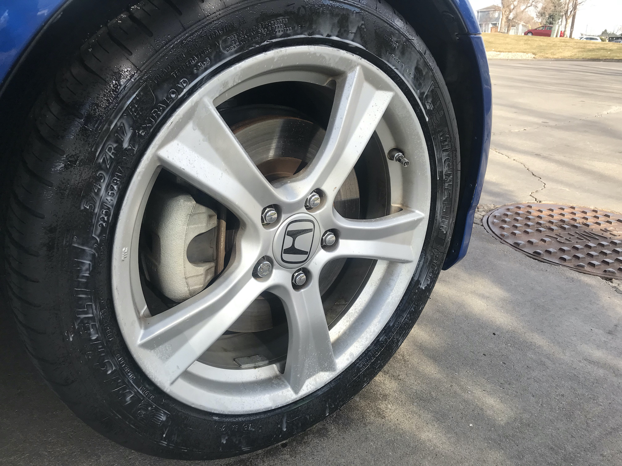 Tire shine sprayed directly on a tire