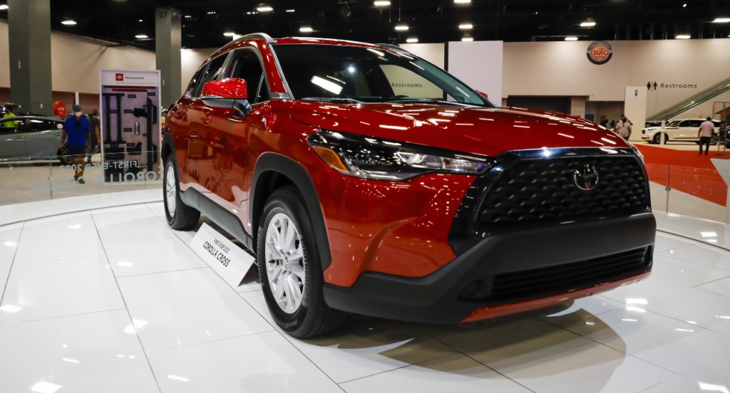 A red 2022 Toyota Corolla Cross is on display.