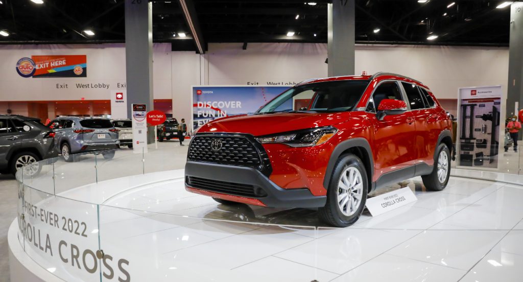 A red 2022 Toyota Corolla Cross is on display. 