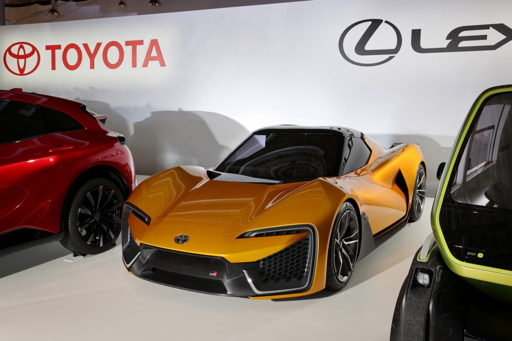 The orange Toyota Sports EV electric sports car concept next to some other EV concepts