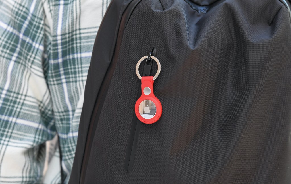 A keyring containing an AirTag attached to a rucksack inside the Apple Store George Street.