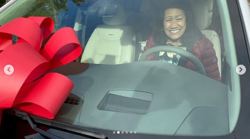 Ata Johnson behind the wheel of a Cadillac CT5.