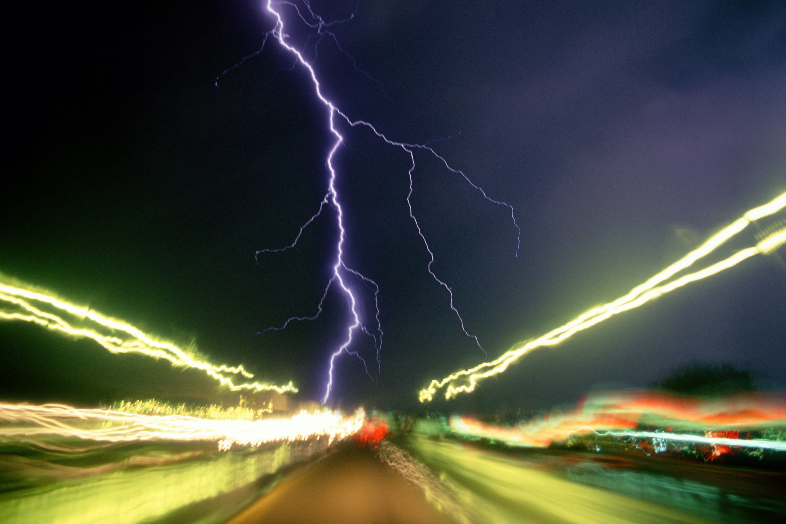 A lightning storm over a freeway