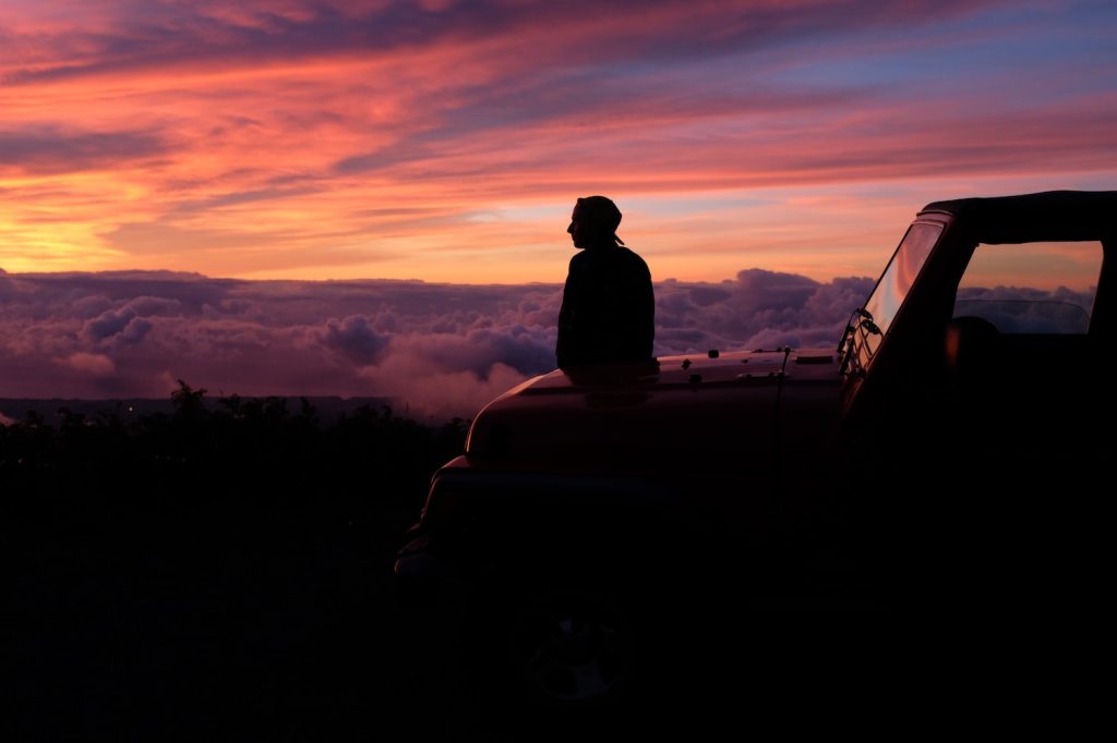 Sitting on a Jeep hood. Washington Post experts might suggest flying for holiday travel. | Karl Fredrickson via Unsplash