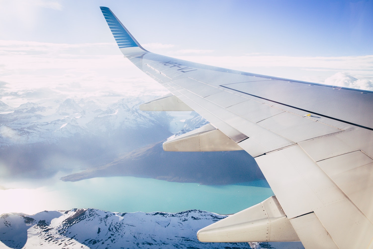 A plane wing. COVID-19 Pandemic era flights are relatively low risk. | Margo Brodowicz via Unsplash
