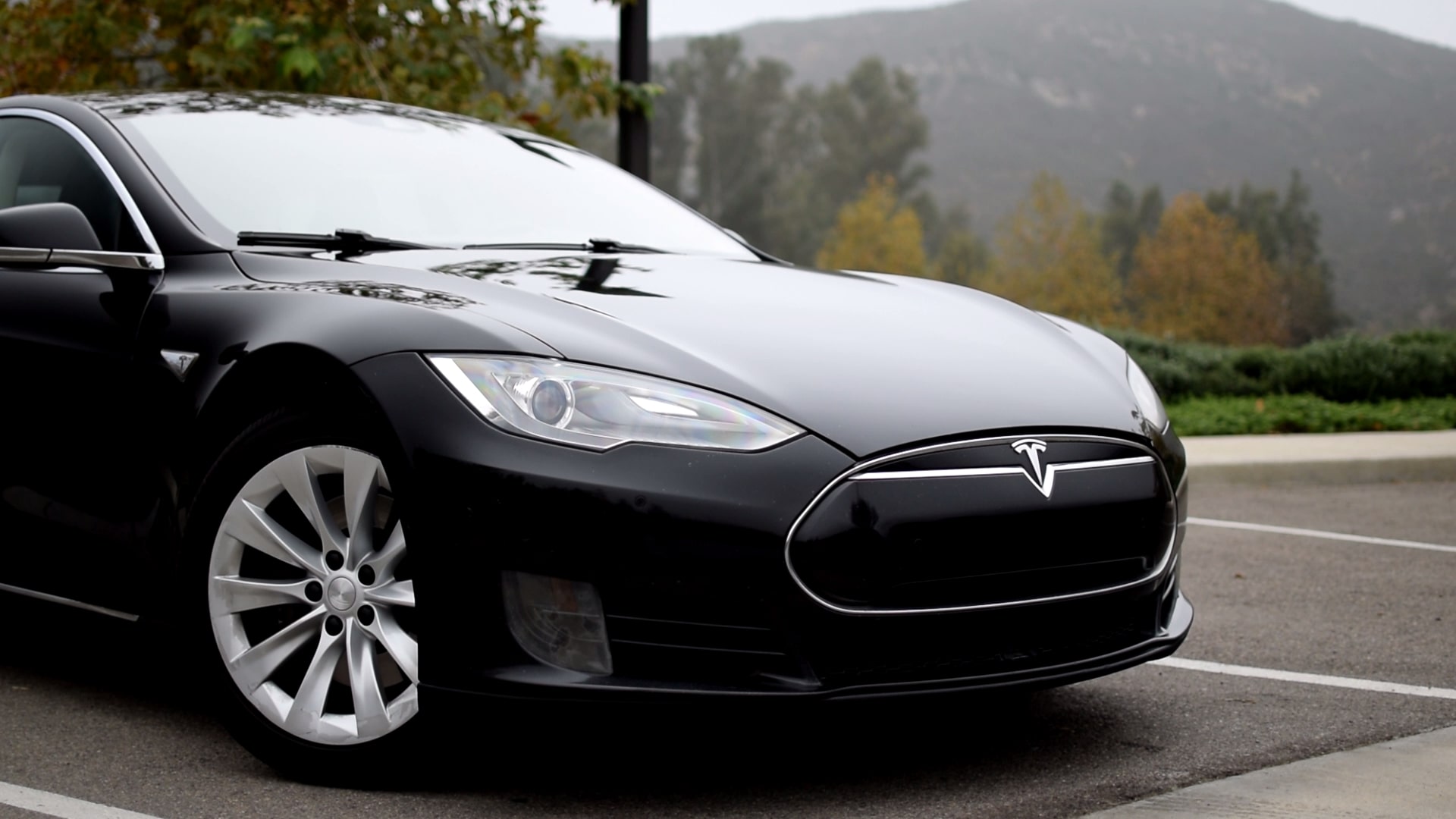 The nose of a black Tesla Model S EV