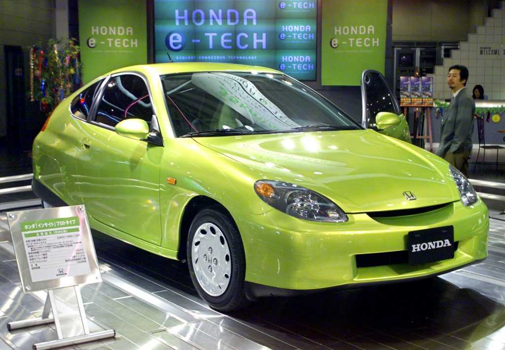 A man looks at a prototype of Honda's new hybrid car "Insight", which will be on sale from this autumn, at Honda headquarters in Tokyo 06 July 1999. 
