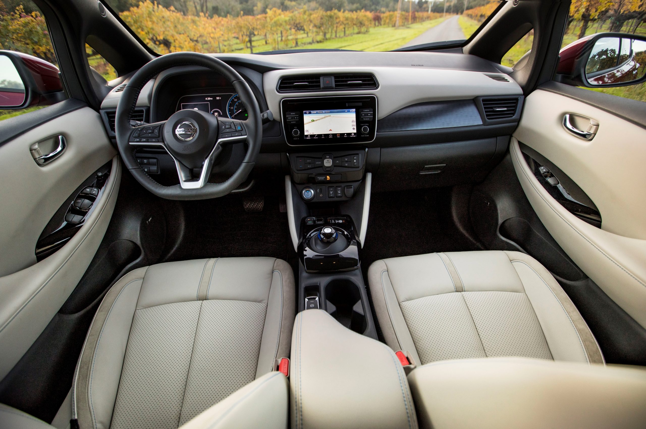 The beige leather interior of Consumer Reports' best EV for under $20K, the Nissan Leaf