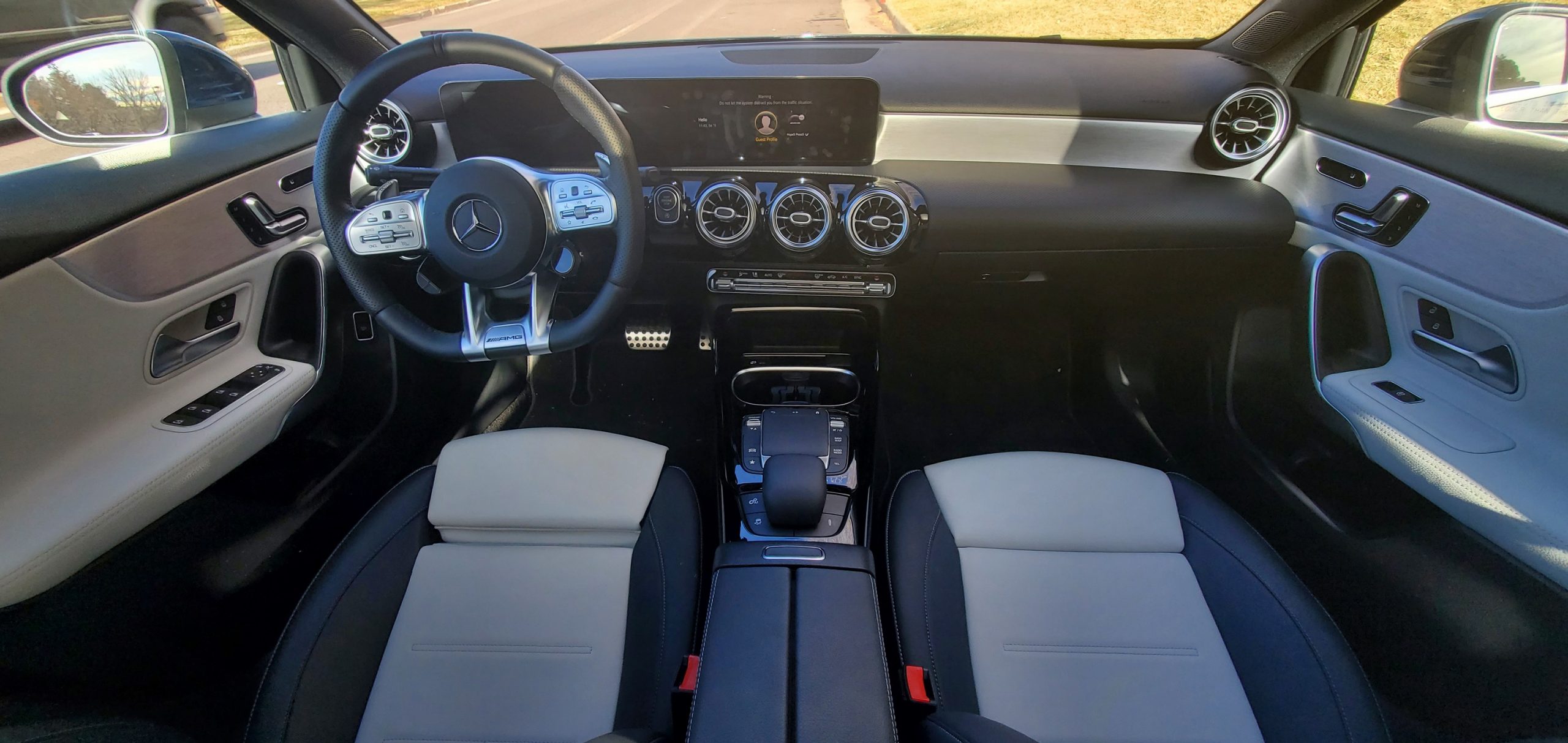 The interior of the AMG A35 sedan with two-tone black and white leather seats