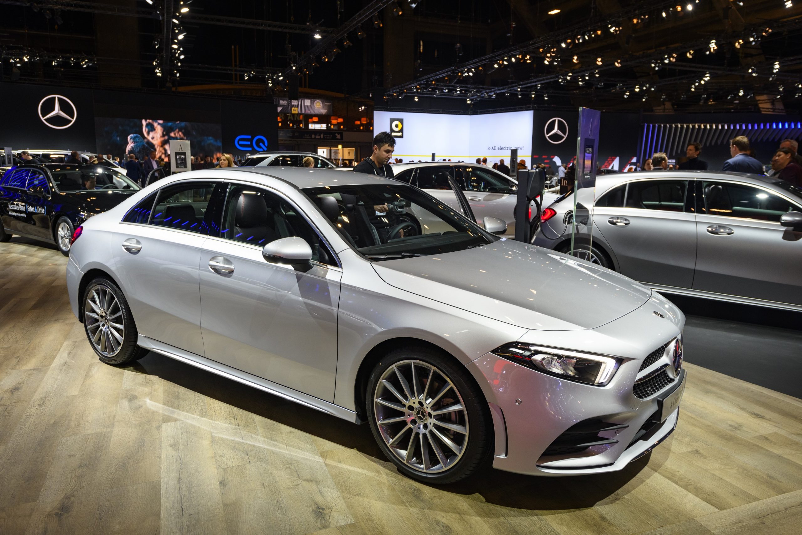 A Mercedes-Benz A Class sedan shot from the 3/4 angle at an auto show