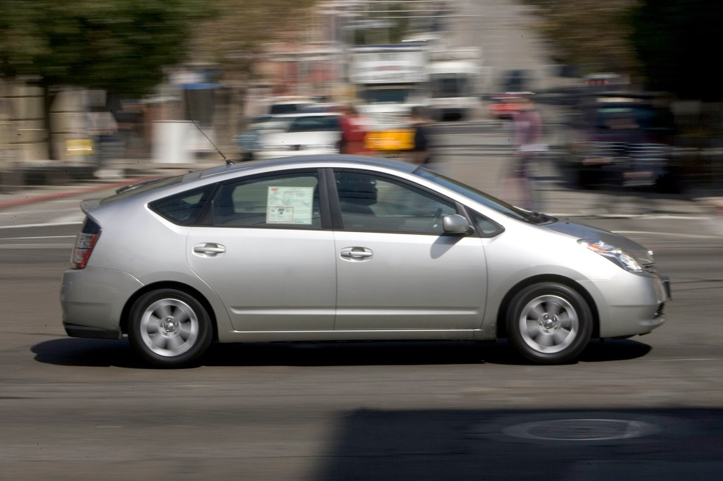  A potential hybrid car buyer test drives a Toyota Prius on September 1, 2005, in San Francisco, California.