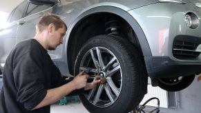 a mechanic replacing tires