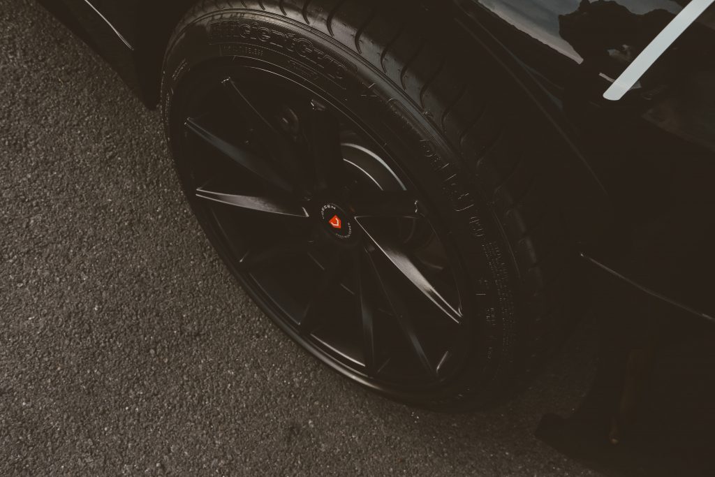 A black tire on a black vehicle.