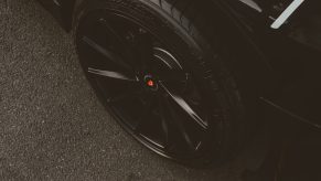 A black tire on a black vehicle.
