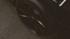 A black tire on a black vehicle.