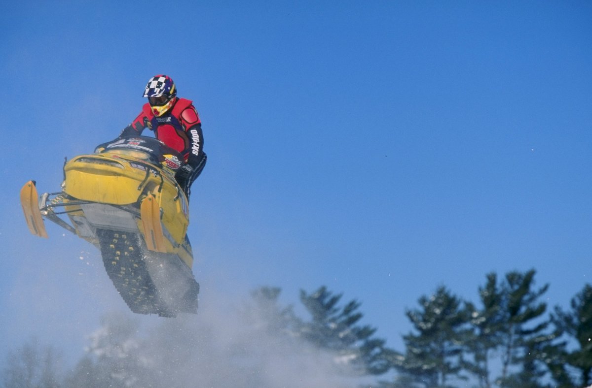 A snowmobile rider in action during the World Championship Snowmobile Derby in Eagle River, Wisconsin