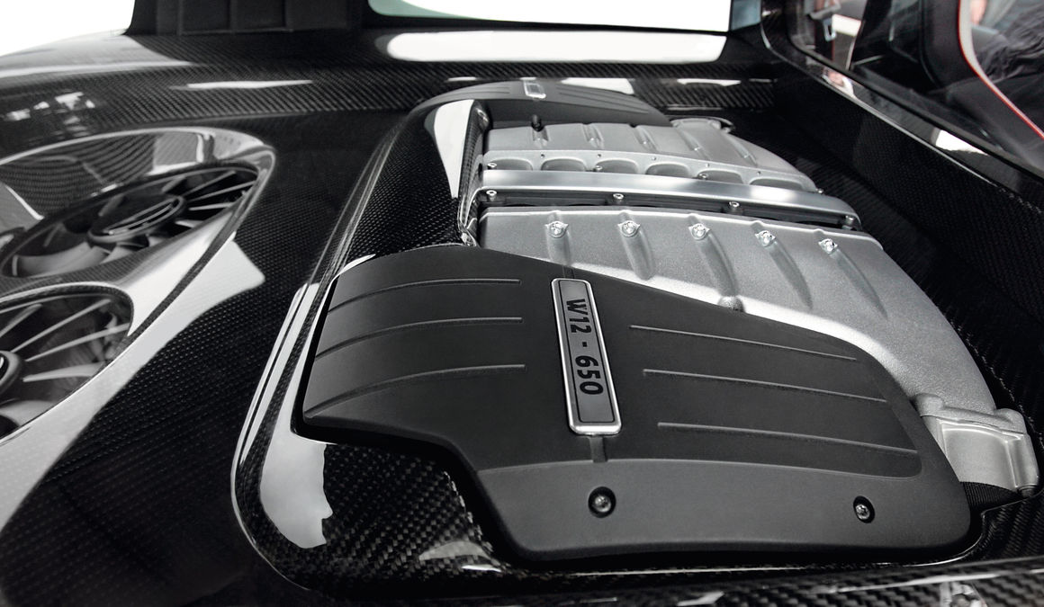A Bentley W12 engine surrounded by carbon fiber, placed in a hot hatch