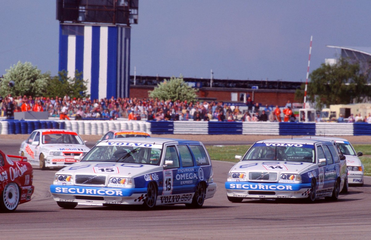 The Volvo 850Rs of Rickard Rydell and Jan Lammers competing in a round of the British Touring Car Championship during the 1994 season.