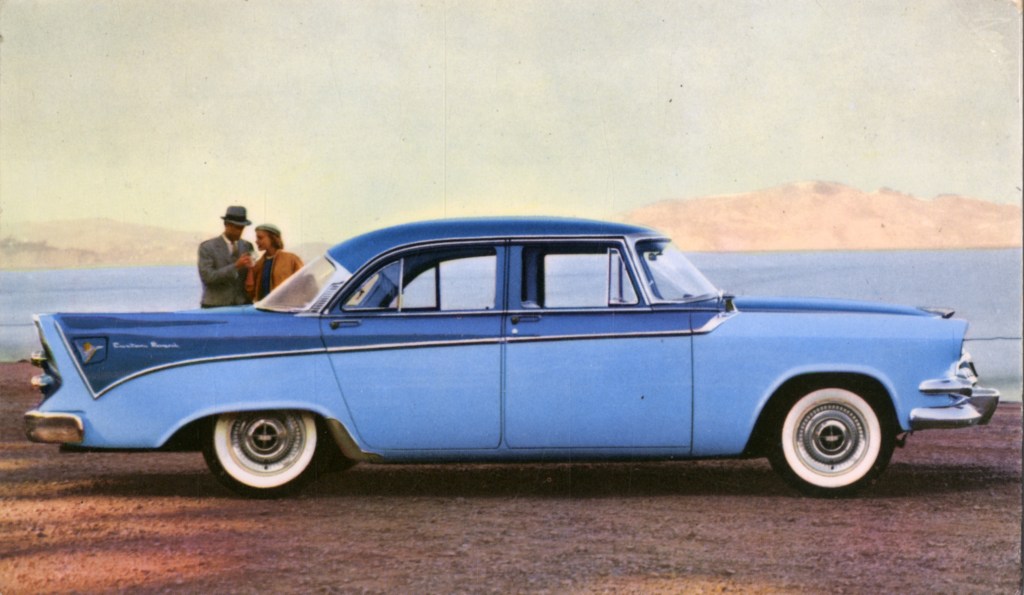 The side view of a blue-on-blue 1956 Dodge Custom Royal Sedan