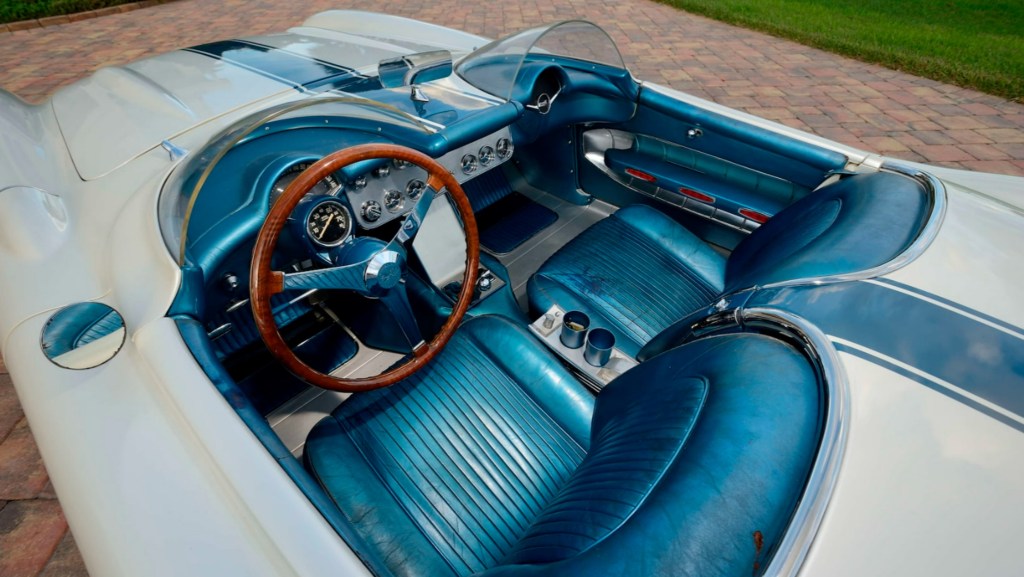 The chrome-and-blue-leather-upholstered interior of the white-with-blue-stripes 1957 Chevrolet Corvette Super Sport