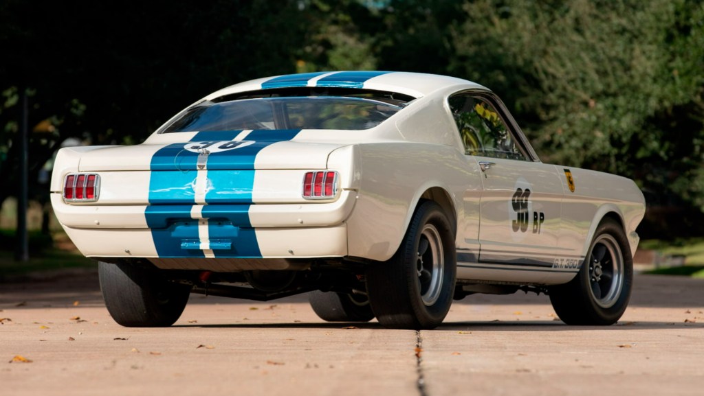 The rear 3/4 view of the white-with-blue-stripes 1965 Shelby GT350R Mustang prototype