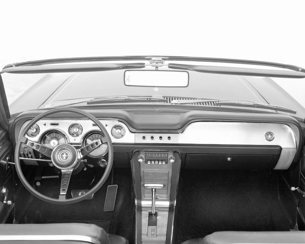 The dashboard of a 1967 Ford Mustang with an automatic transmission