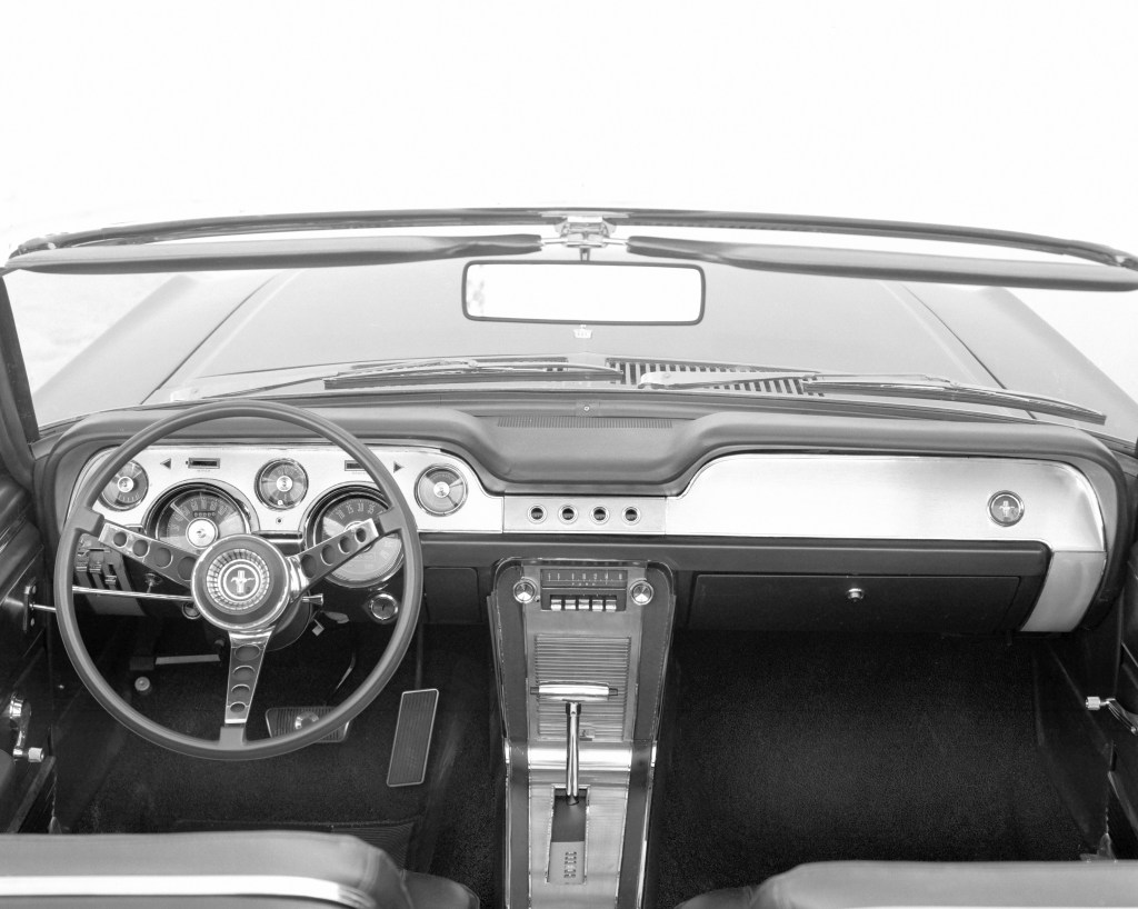 The dashboard of a 1967 Ford Mustang with an automatic transmission