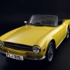 A yellow 1973 Triumph TR6
