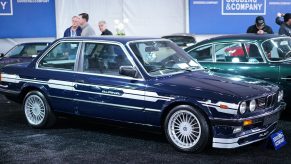 A blue-and-white 1984 E30 Alpina C1 2.3 at a Gooding & Company auction