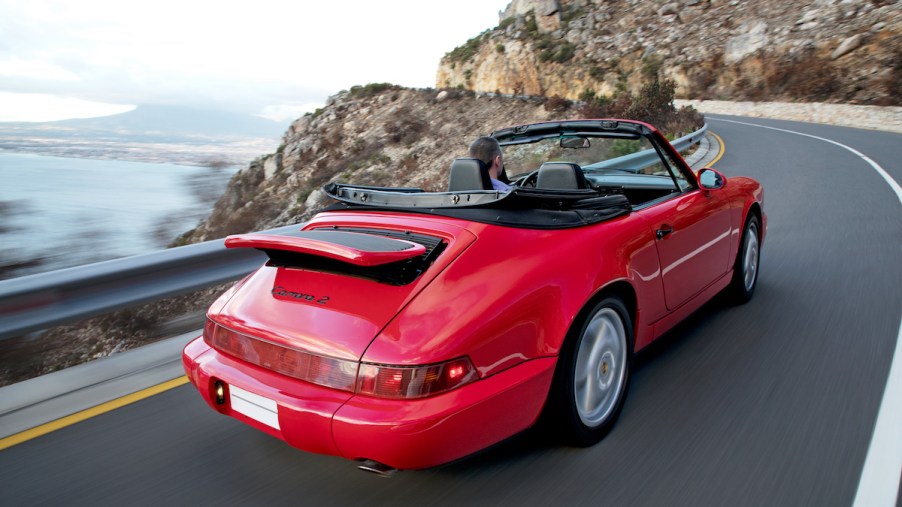 A 1990 Porsche 964 Carrera 2 Cabriolet sports car on a mountain in South Africa in 2018
