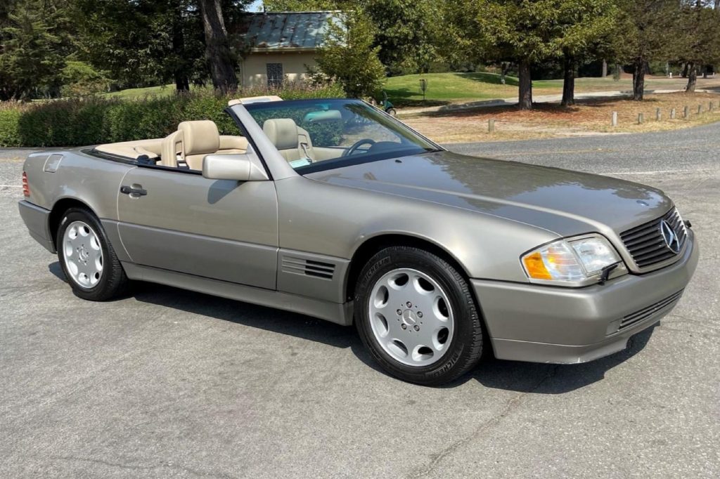 A tan-and-gray 1995 R129 Mercedes SL 320 in a parking lot