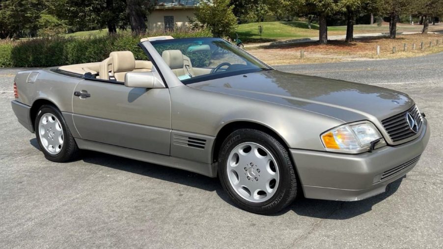 A tan-and-gray 1995 R129 Mercedes SL 320 in a parking lot