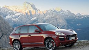 A red 2008 Porsche Cayenne GTS in the mountains