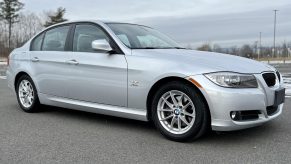 A silver 2010 BMW 328i xDrive sedan in a parking lot